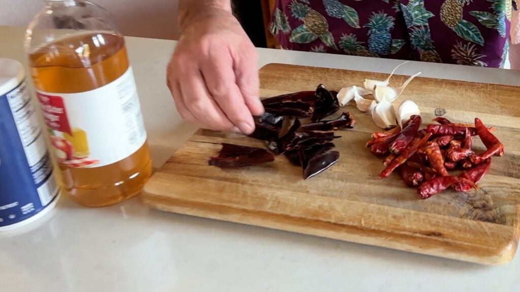 Photo shows chiles and garlic on the cutting board