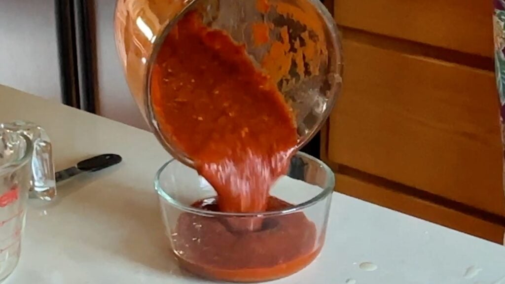 Photo shows pouring salsa from blender into bowl