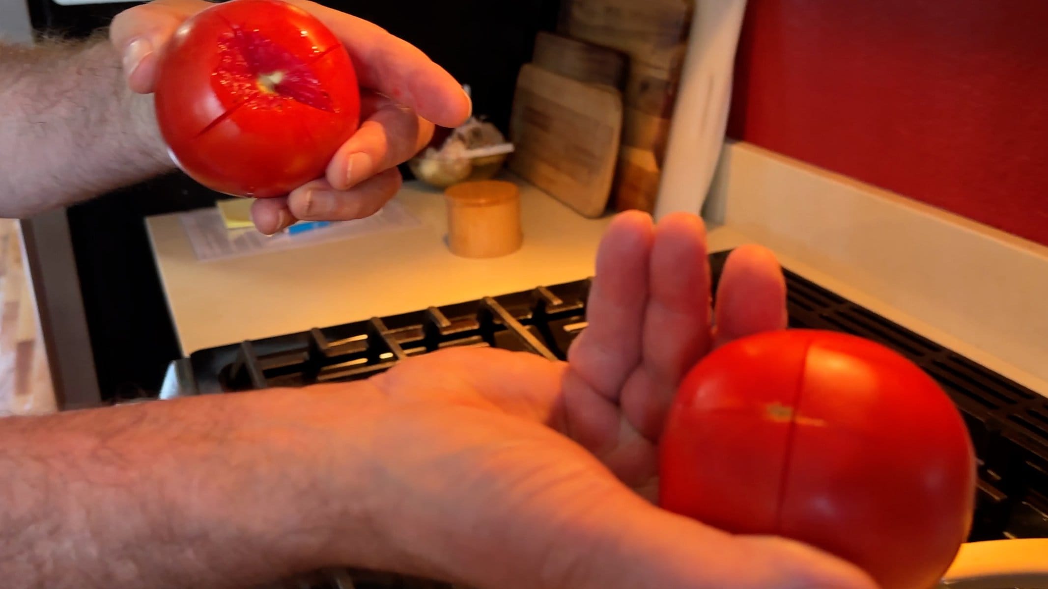 Tomatoes showing the 'x' knife cut in the ends