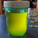Photo shows a pint jar of clear yellow butter