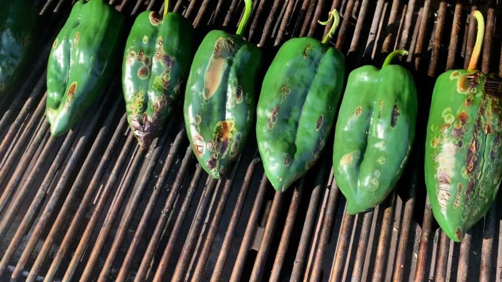 Photo shows chiles darkening on the grill