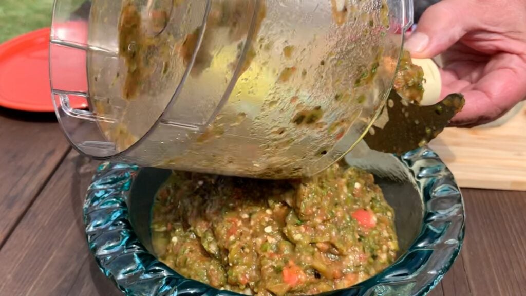 Photo shows pouring the processed salsa into a bowl