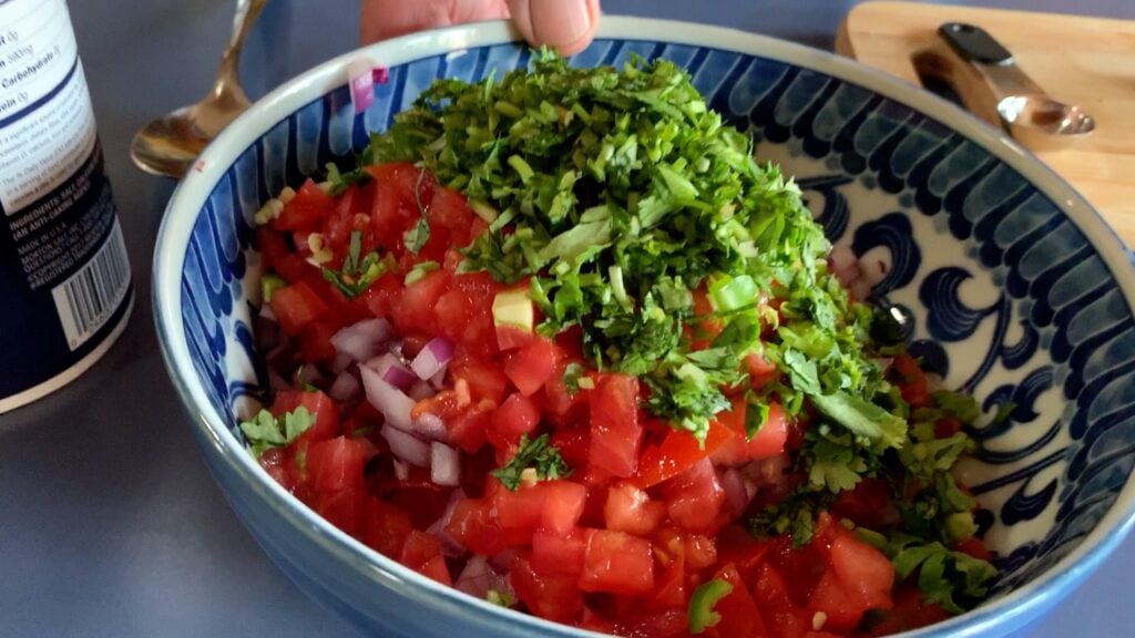 Photo shows a bowl full of chopped vegetables