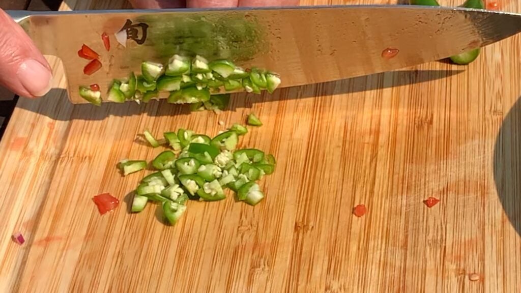 Photo shows a serrano being diced small