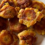 Photo shows crispy tostones on a p-late.