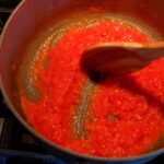 Photo shows thick tomato sauce in the pan.