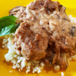 Photo shows Curry Pork Tenderloin served over Cauliflower Rice