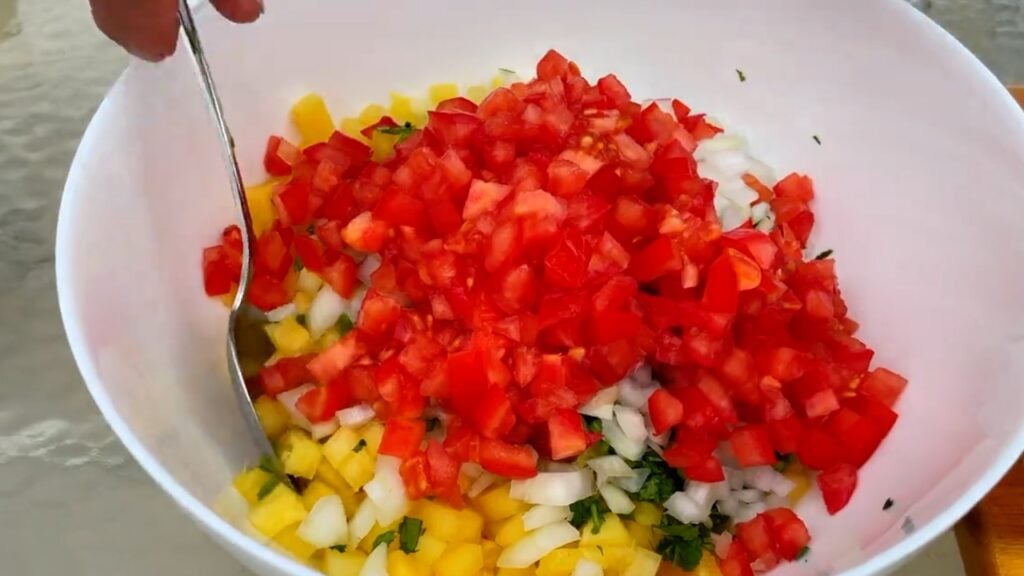 Photo shows the bowl with onion and tomato added