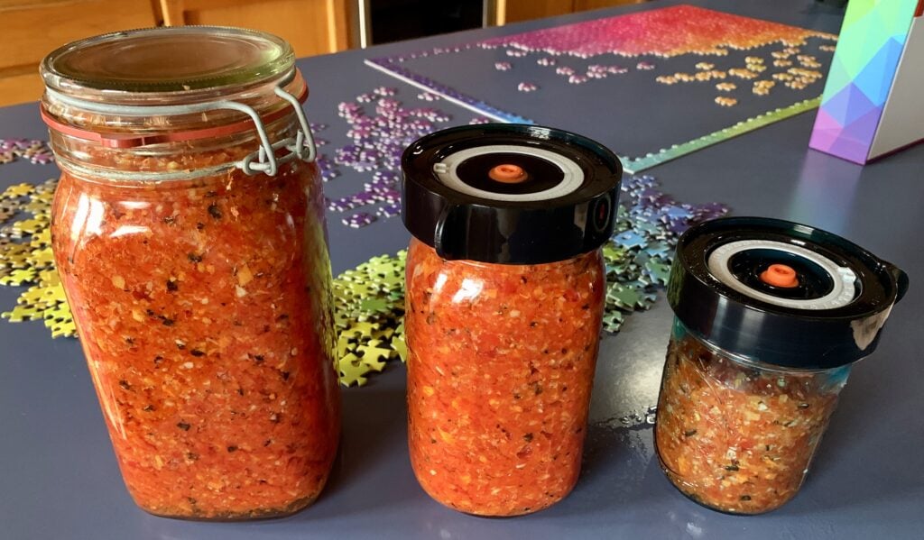 Photo shows hot sauce fermenting in jars