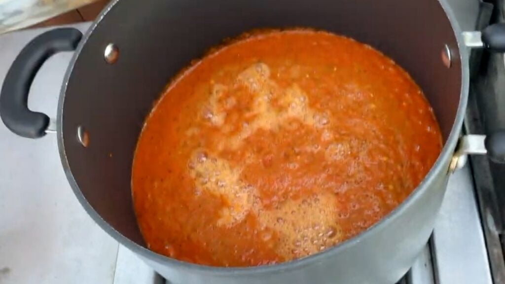 Photo shows the blended sauce in the pan with 2 cups of vinegar
