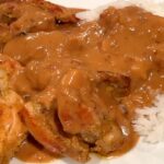 Photo shows Chicken Satay With Peanut Sauce served with rice