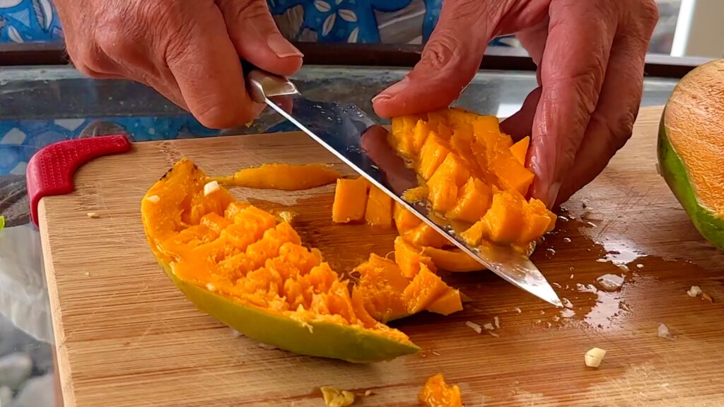 Photo shows the mango being cut
