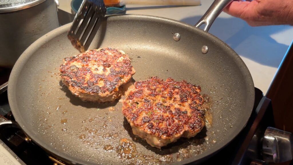 Cook the hamburger patties until they are crispy on both sides