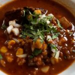 Photo shows a bowl of Beef Birria