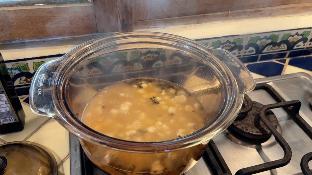 Photo shows hominy and Mexican oregano in the chicken broth