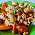 Photo shows Kung Pao Chicken plated with rice