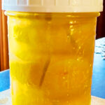 Photo shows a jar of preserved lemons