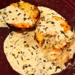 Photo shows the Crab Cakes served with tarragon cream sauce
