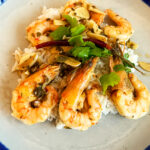 Photo shows the Camarones Miramar plated with rice